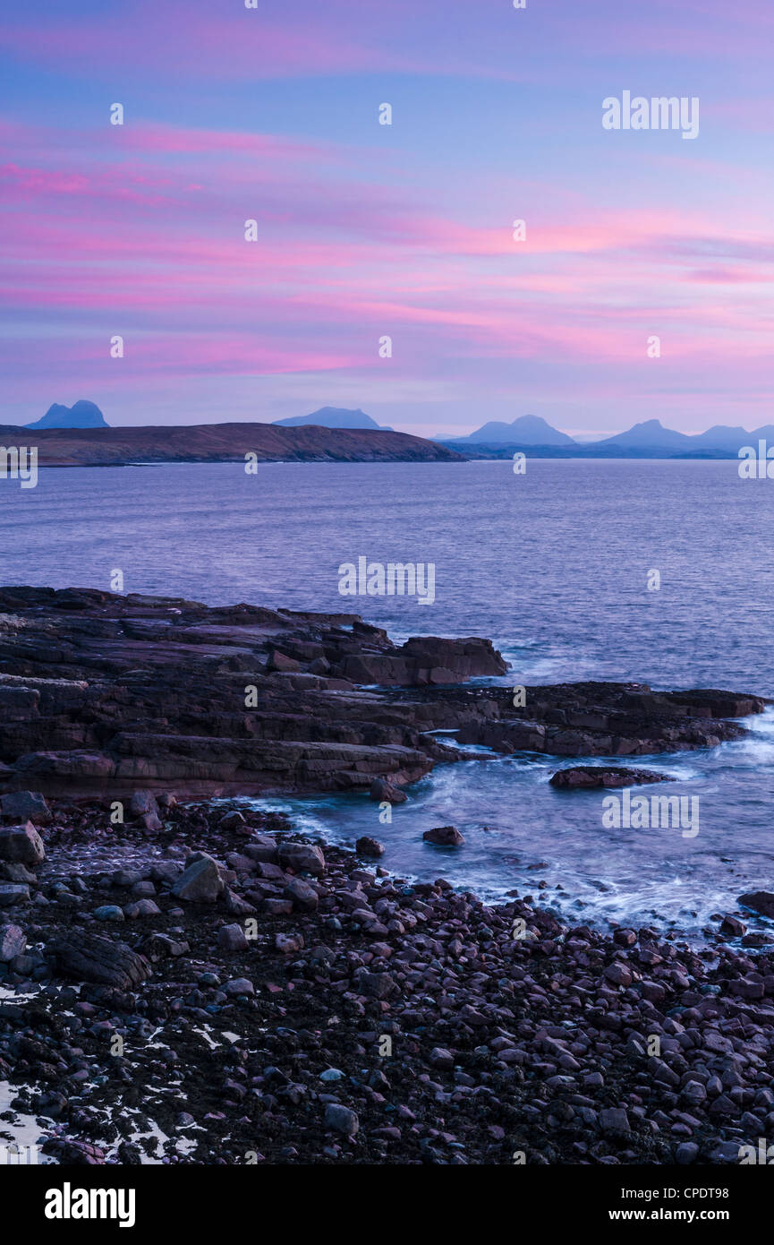 The mountains of Inverpolly from Stoer Lighthouse at sunset, Highlands, Scotland, UK Stock Photo