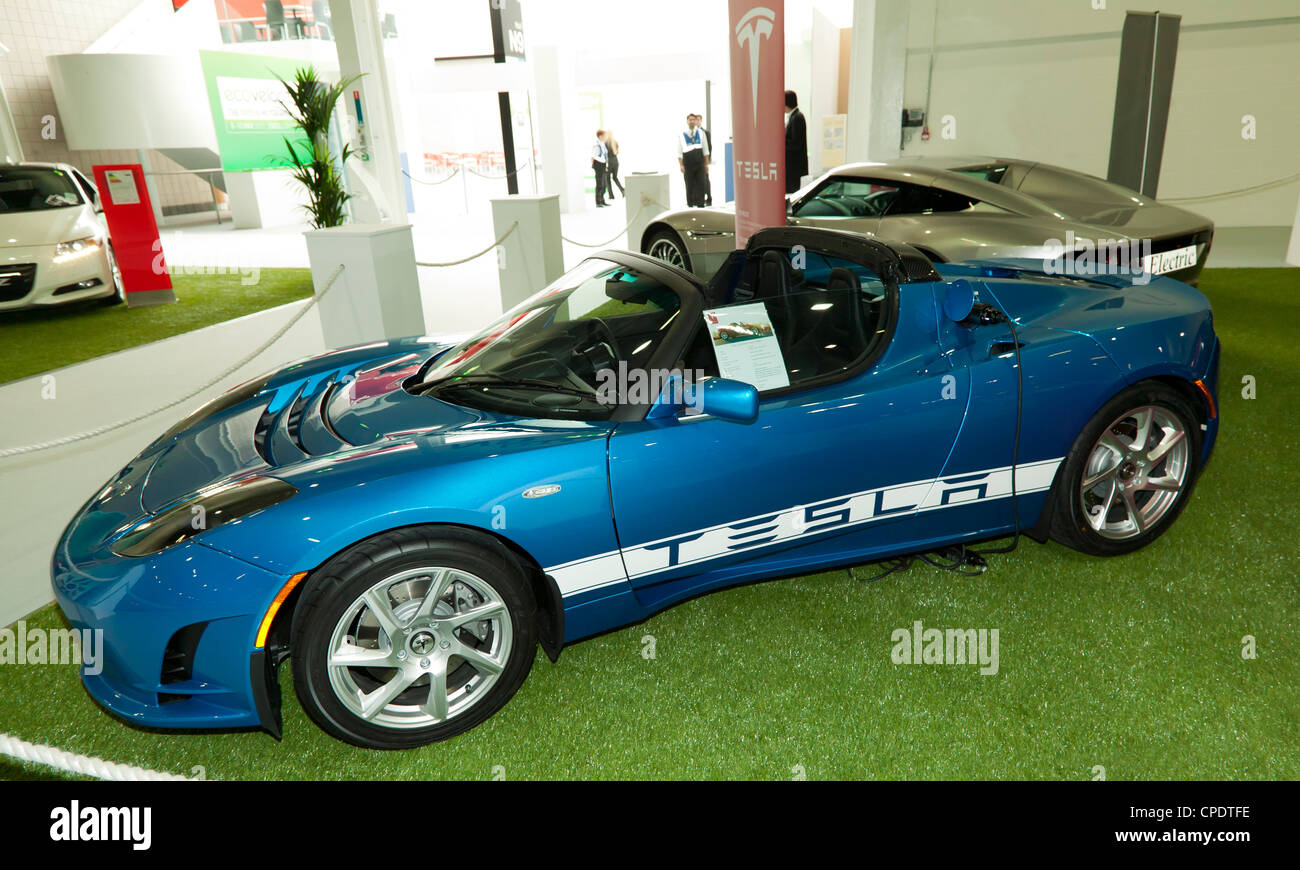 Side view of the Tesla Roadster, a high performance, all electric sports car, on show at ecovelocity, Excel, London Stock Photo