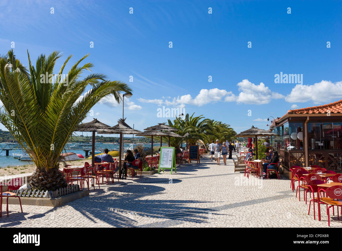 Seafront restaurants by the harbour in the resort of Alvor, near