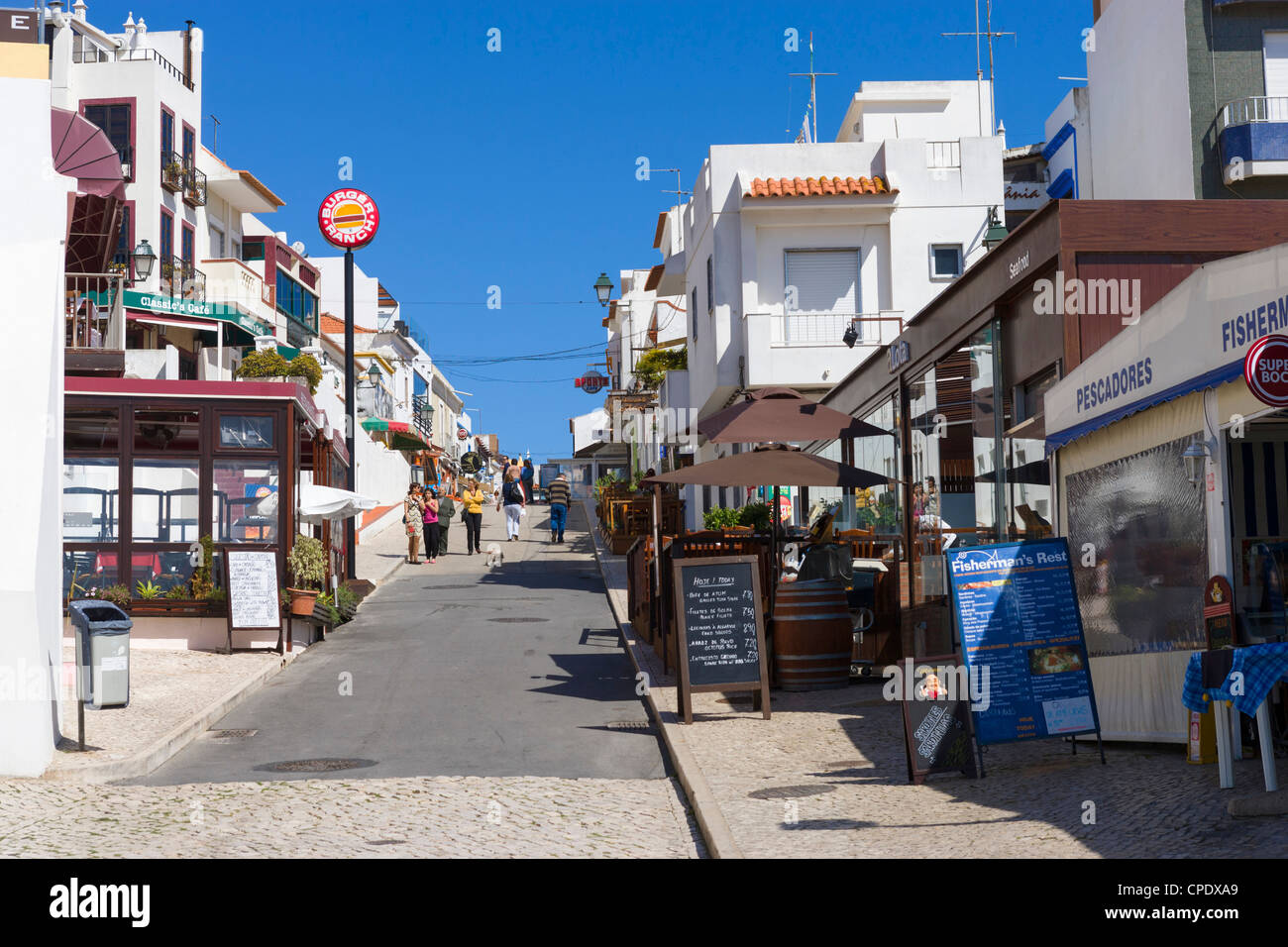 Shops and bars in the centre of the resort of Alvor, near Portimao, Algarve, Portugal Stock Photo