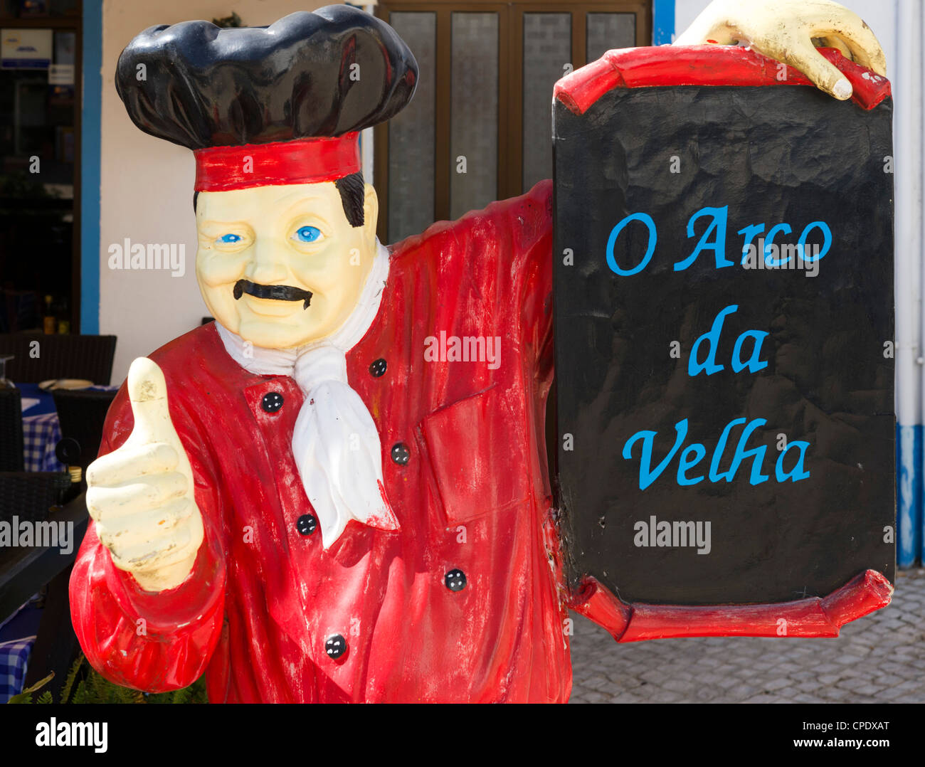 Mannequin of a chef displaying a sign outside a restaurant in Alvor, near Portimao, Algarve, Portugal Stock Photo