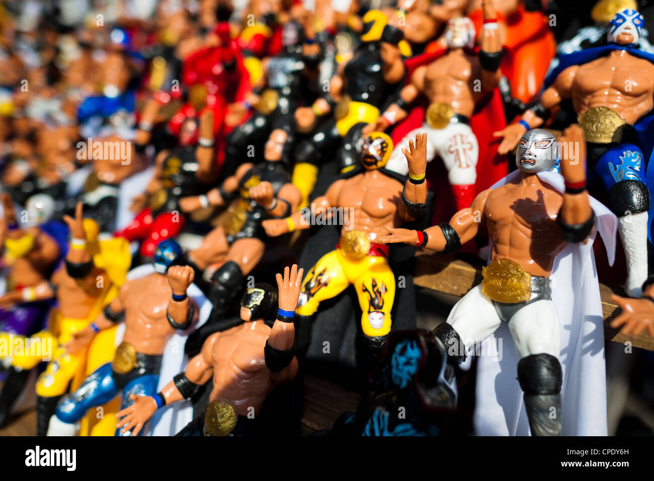 Colorful figures of the Lucha libre (Mexican wrestling) wrestlers for sale in a street shop in Mexico City, Mexico. Stock Photo