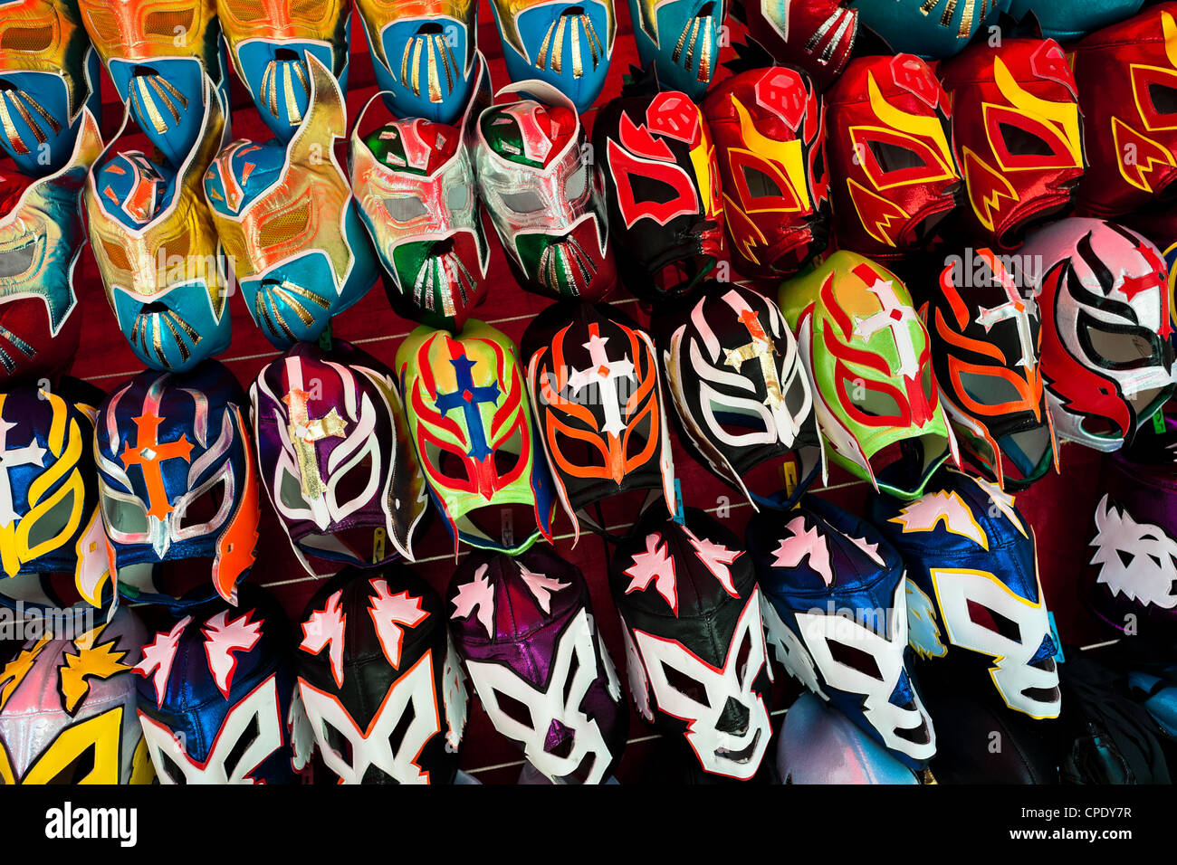 Colorful Lucha libre (Mexican wrestling) masks for sale on a stall at a local arena in Mexico City, Mexico. Stock Photo