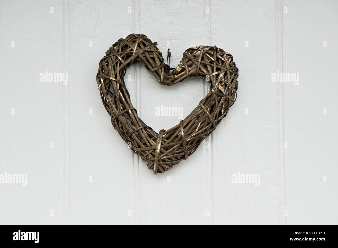 Craft Wooden heart on a front door Stock Photo