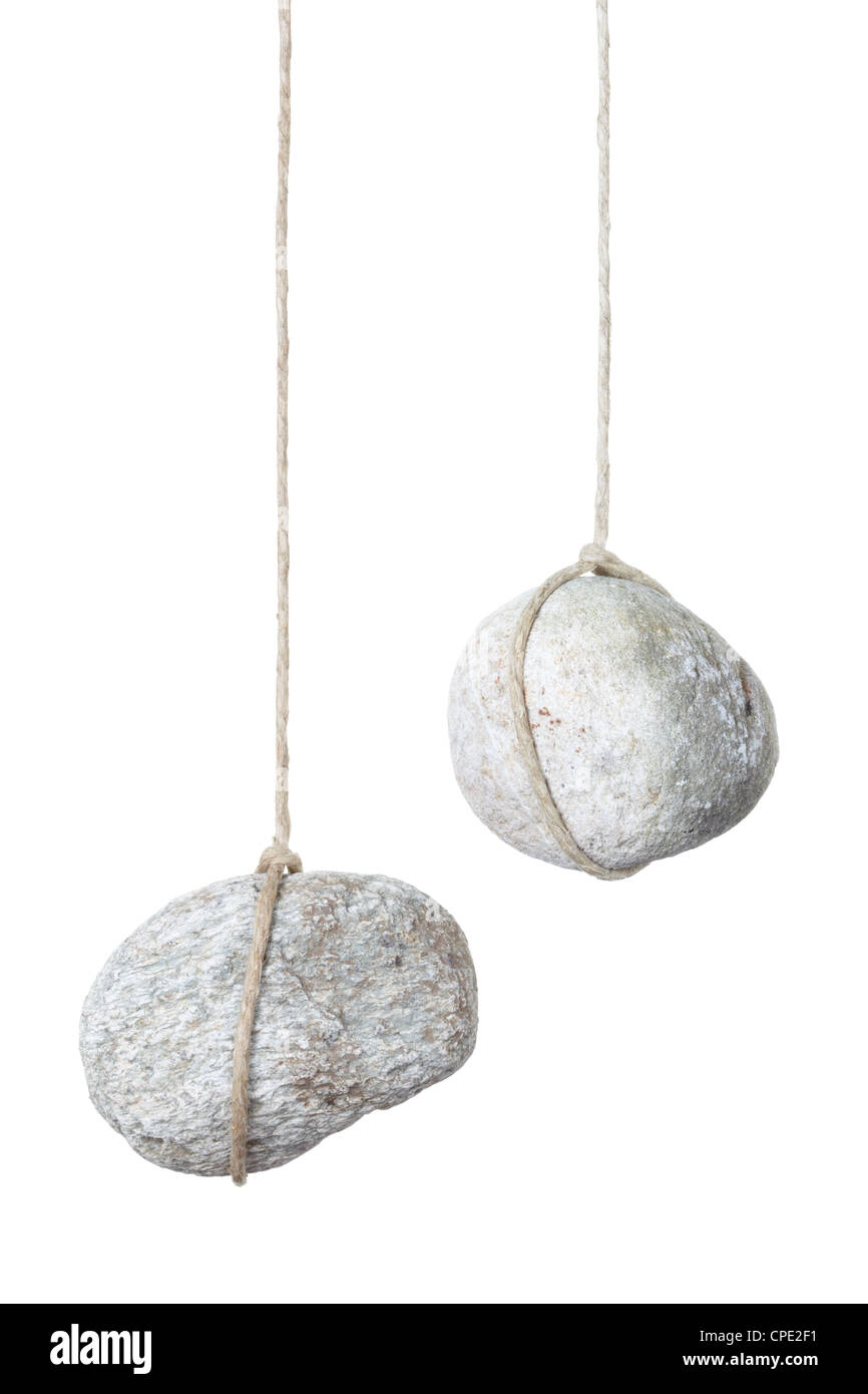 Stone hanging on a string Stock Photo