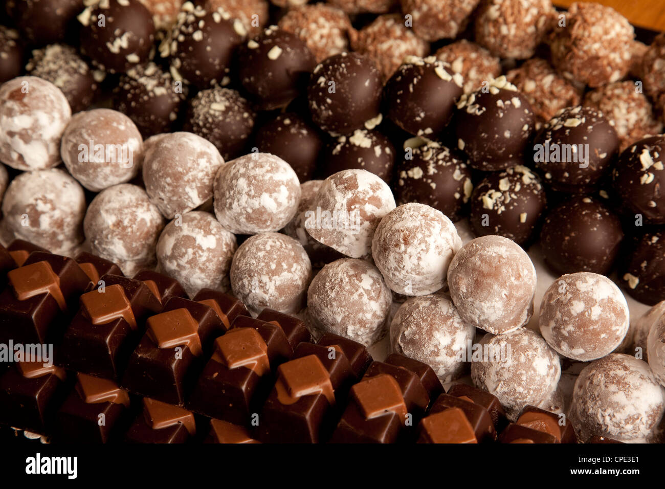 Closeup of rows of chocolates in a French cafe, France, Europe Stock