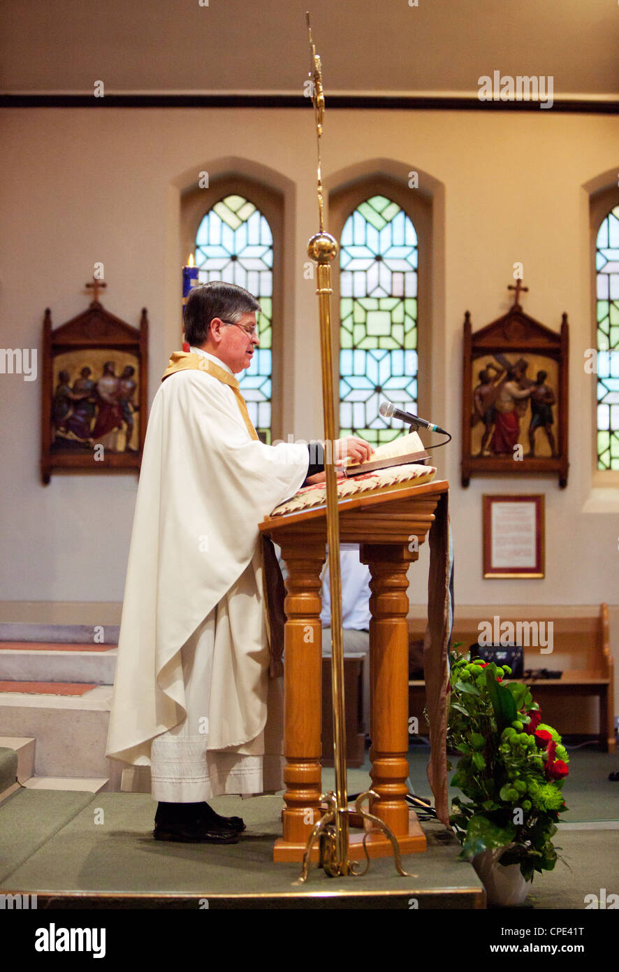 Catholic priest celebrates mass in a church, London, England, UK. Stock Photo