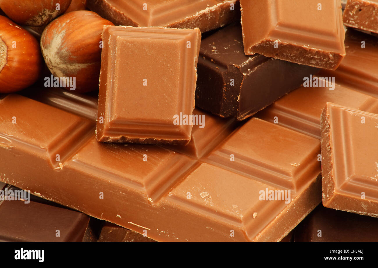 A real Milk chocolate bar with milk and dark chocolate chunks on the top Stock Photo