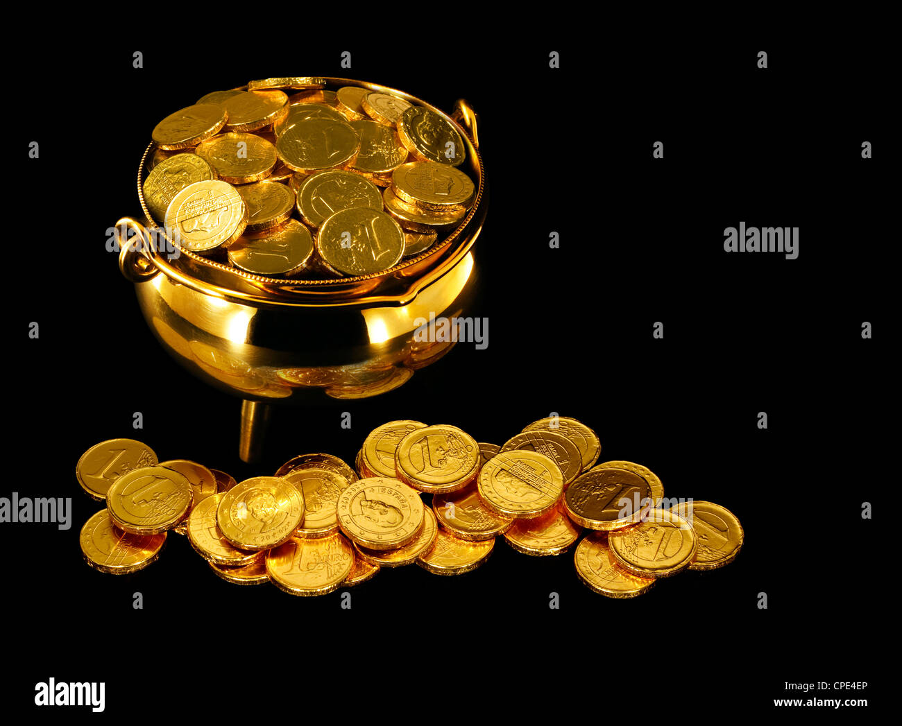Pot of Gold Coins a symbol of The Luck of the Irish or St Patrick's Day Stock Photo