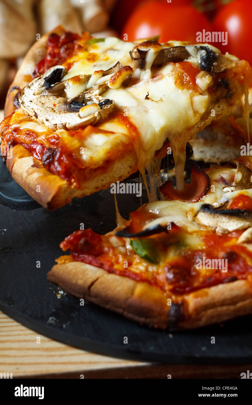 Stringy cheese pizza hi-res stock photography and images - Alamy