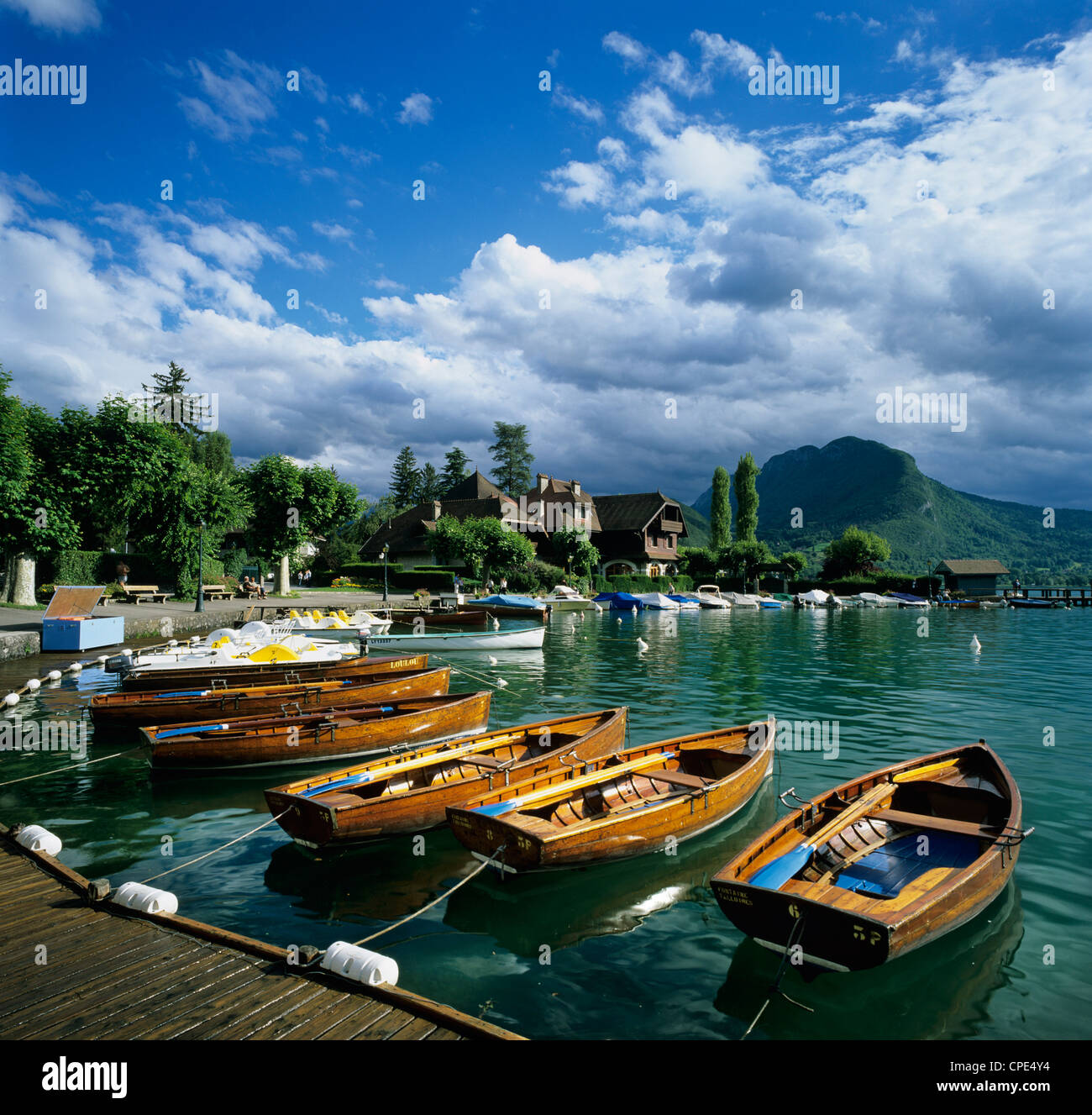 Rowing boats along lake shore, Talloires, Lake Annecy, Rhone Alpes