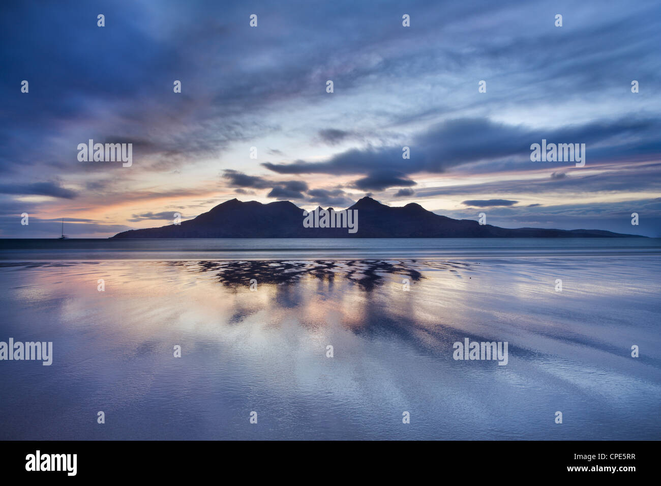 Dusk, looking to towards Rum from the Bay of Laig on Eigg, Inner Hebrides, Scotland, United Kingdom, Europe Stock Photo