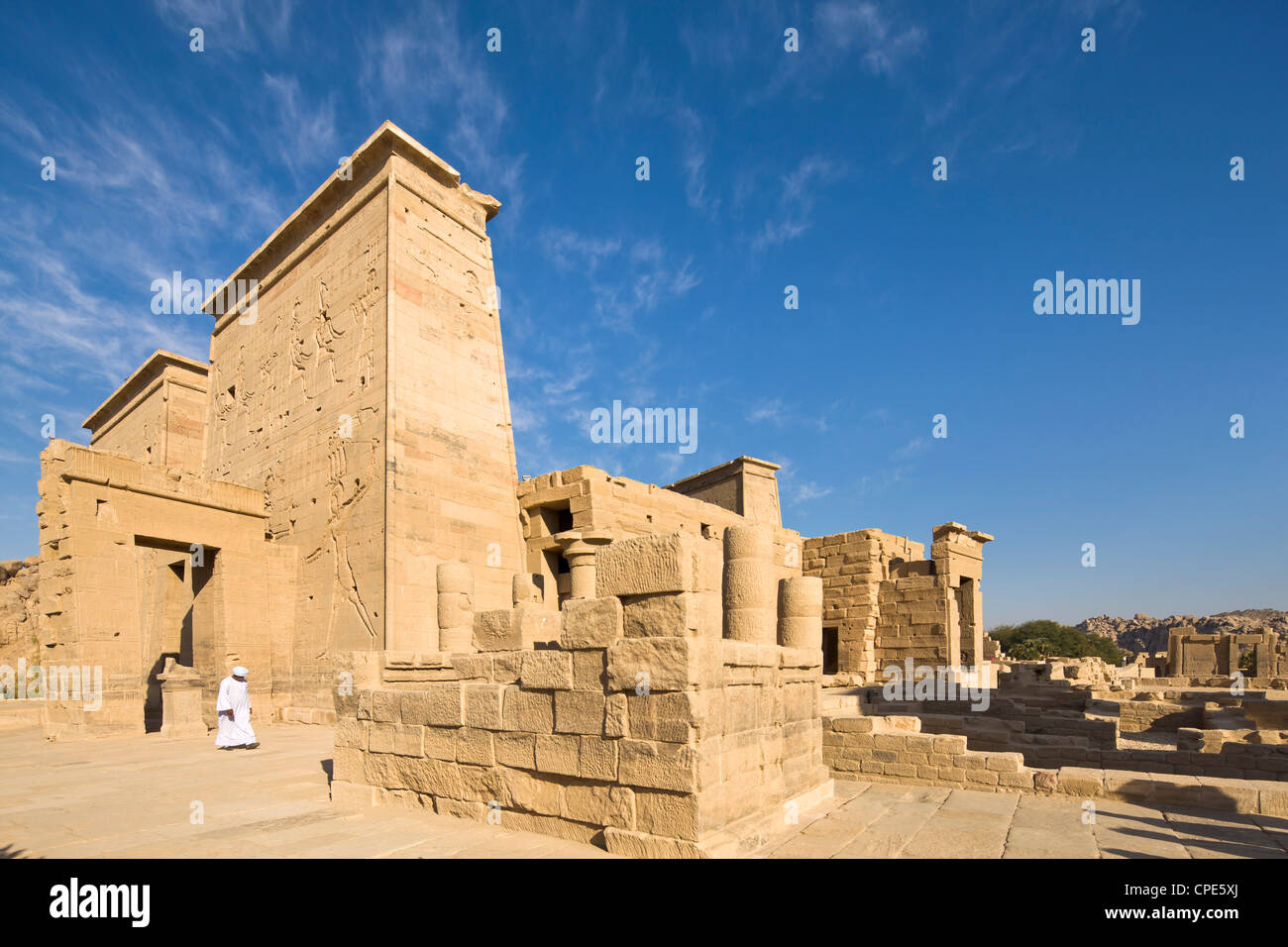 Man in jellabiya by the first pylon and the Gate of Ptolemy at the Temple of Isis, Philae, Nubia, Egypt, Africa Stock Photo