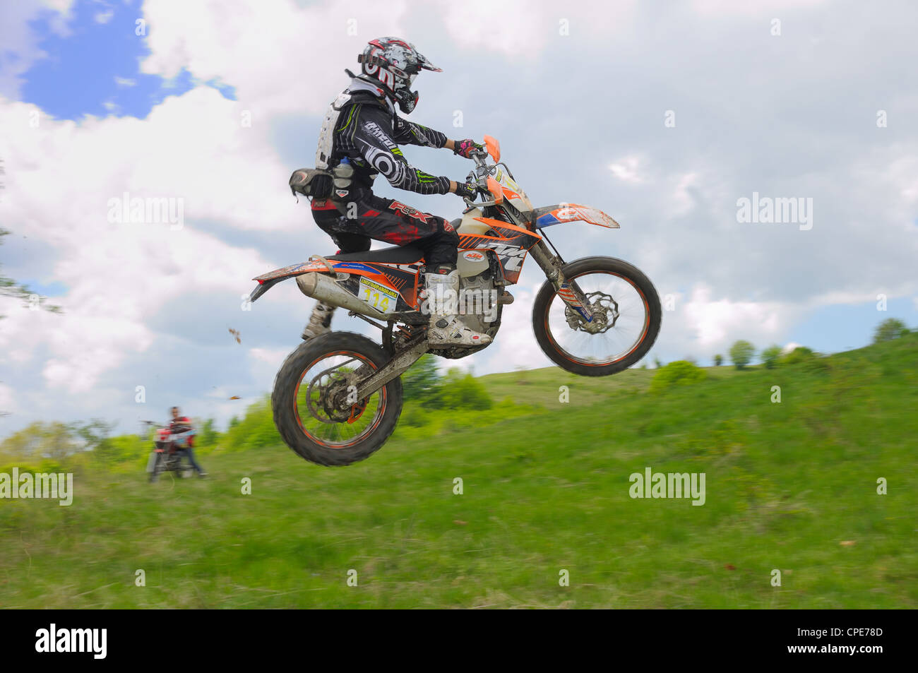 GHELARI, ROMANIA - MAY 5 2012: Norbert Levente JOZSA in action, jumping with his KTM bike, at  'Enduro Panorama 2012' Stock Photo