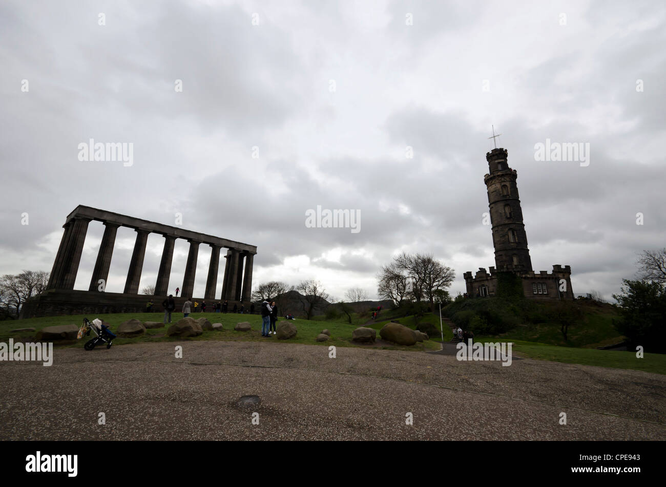 The Edinburgh Monument 'Edinburgh's Disgrace' and the Nelson Monument on Calton Hill in the centre of Edinburgh, Scotland. Stock Photo