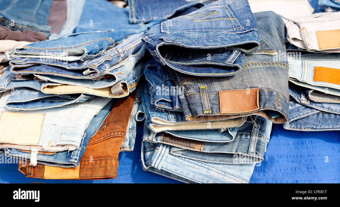 Blue jeans denim fashion pants mixed colors stacked Stock Photo Alamy