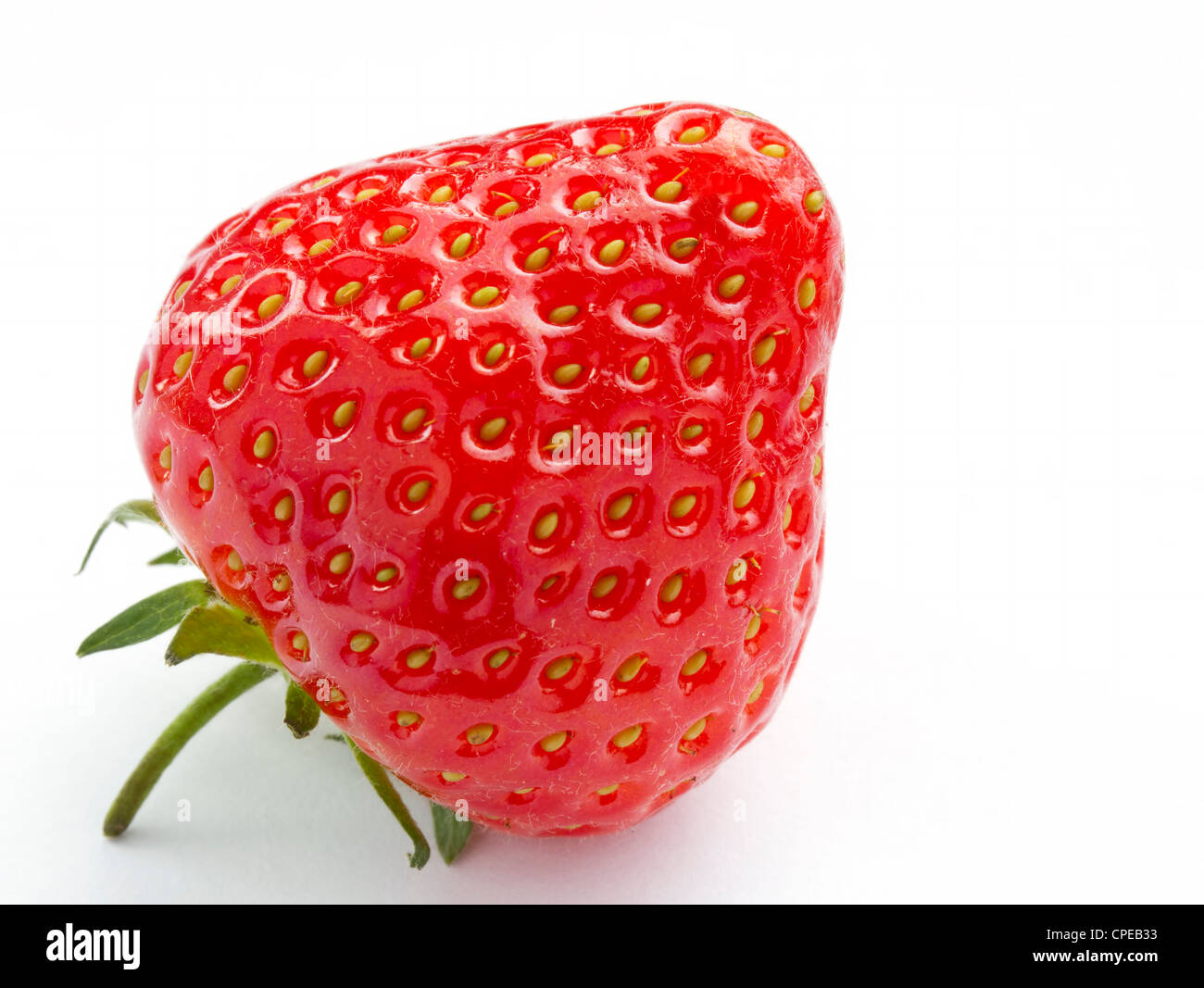 Ripe strawberry on white background Stock Photo - Alamy