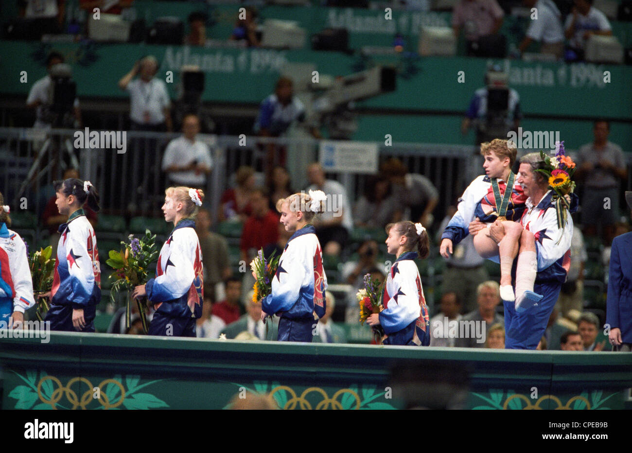 Bela Karolyi USA Coach Carries Kerri Strug (USA) With Her Injured Ankle ...