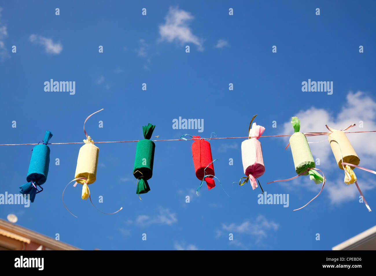 Fallas decoration fake fireworks colorful in a row rope Stock Photo - Alamy