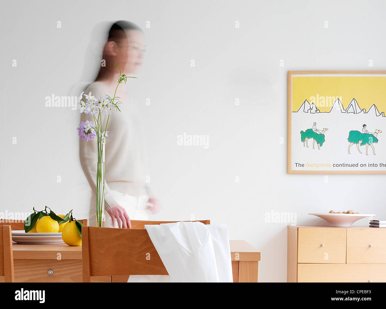 Women Standing By Dining Table, Motion Blur Stock Photo