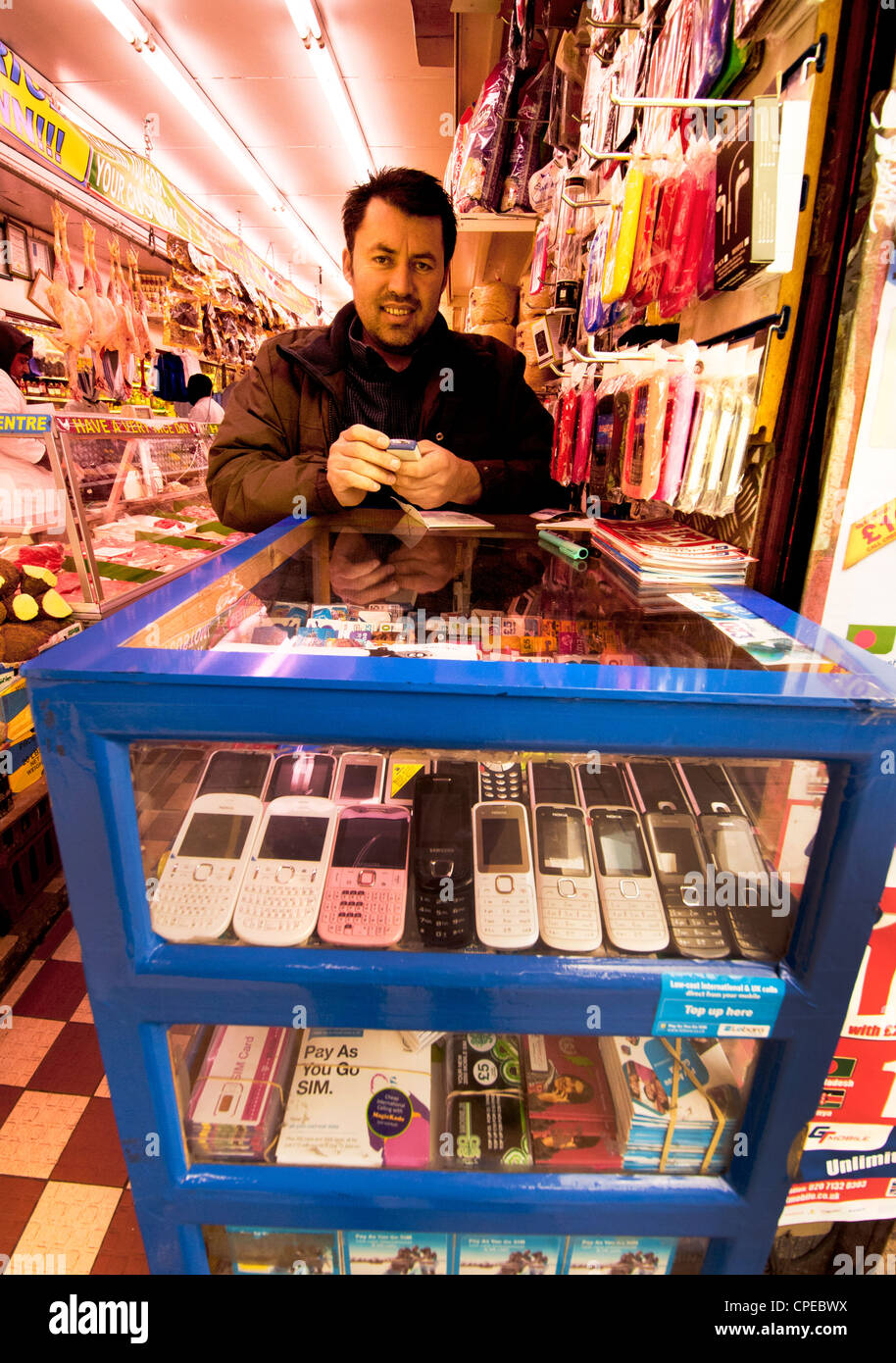 Unlocking phone mobiles sim cards hires stock photography and images