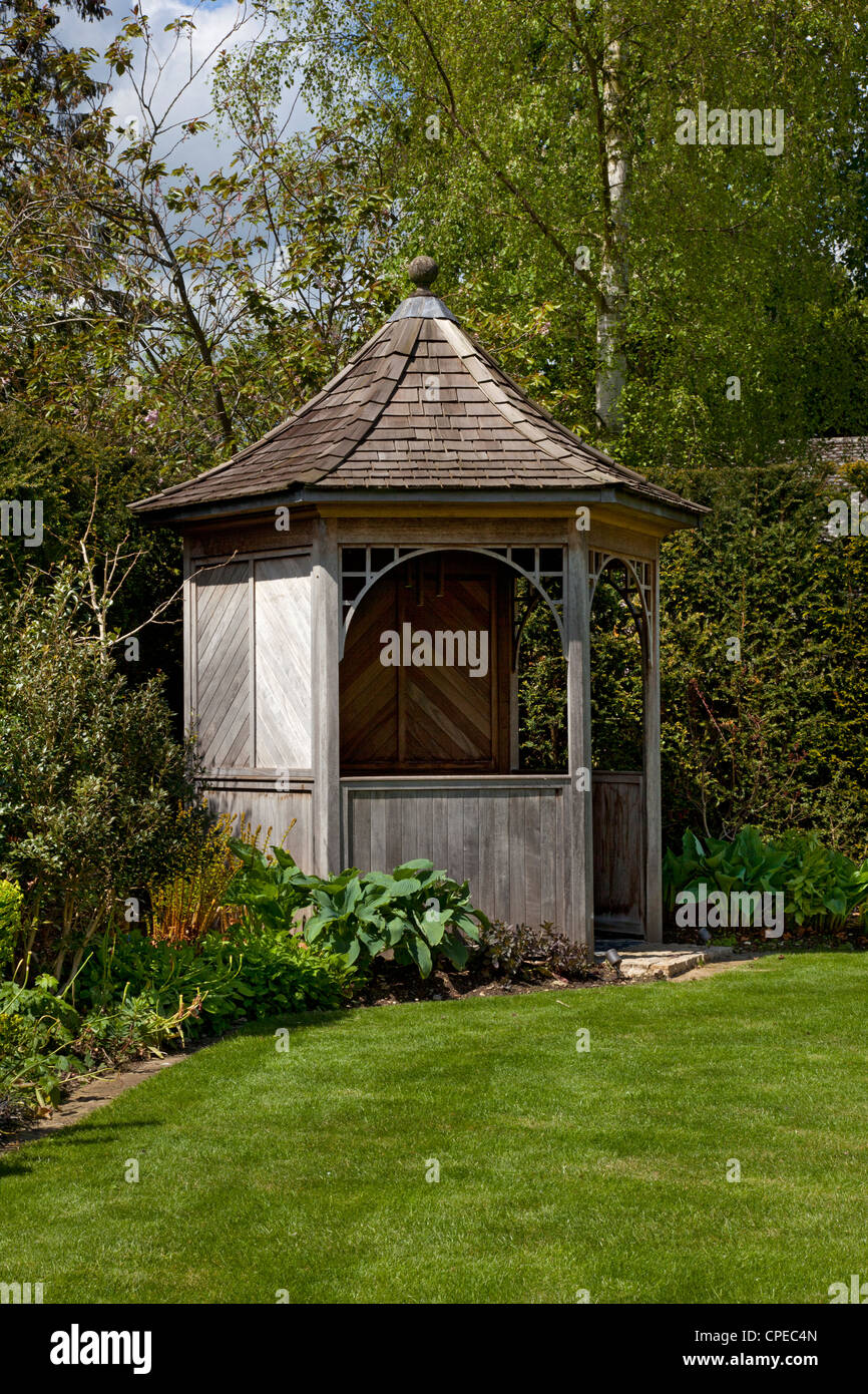 Wooden gazebo feature in English garden Stock Photo
