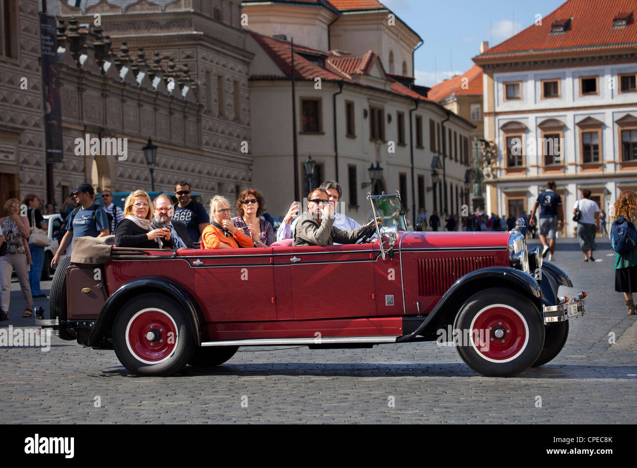 Skoda car and tourists. Prague, Czech Republic. Stock Photo