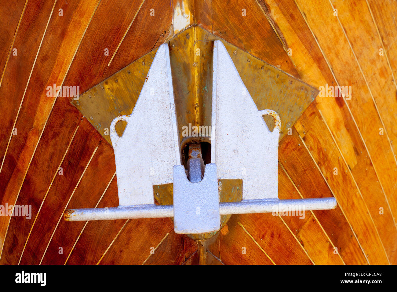 anchor detail in silver color on a wooden hull boat Stock Photo