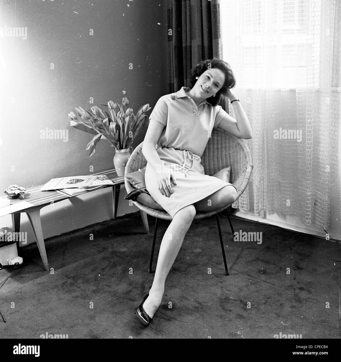 Image From The Sixties Showing A Young Lady Relaxing In A