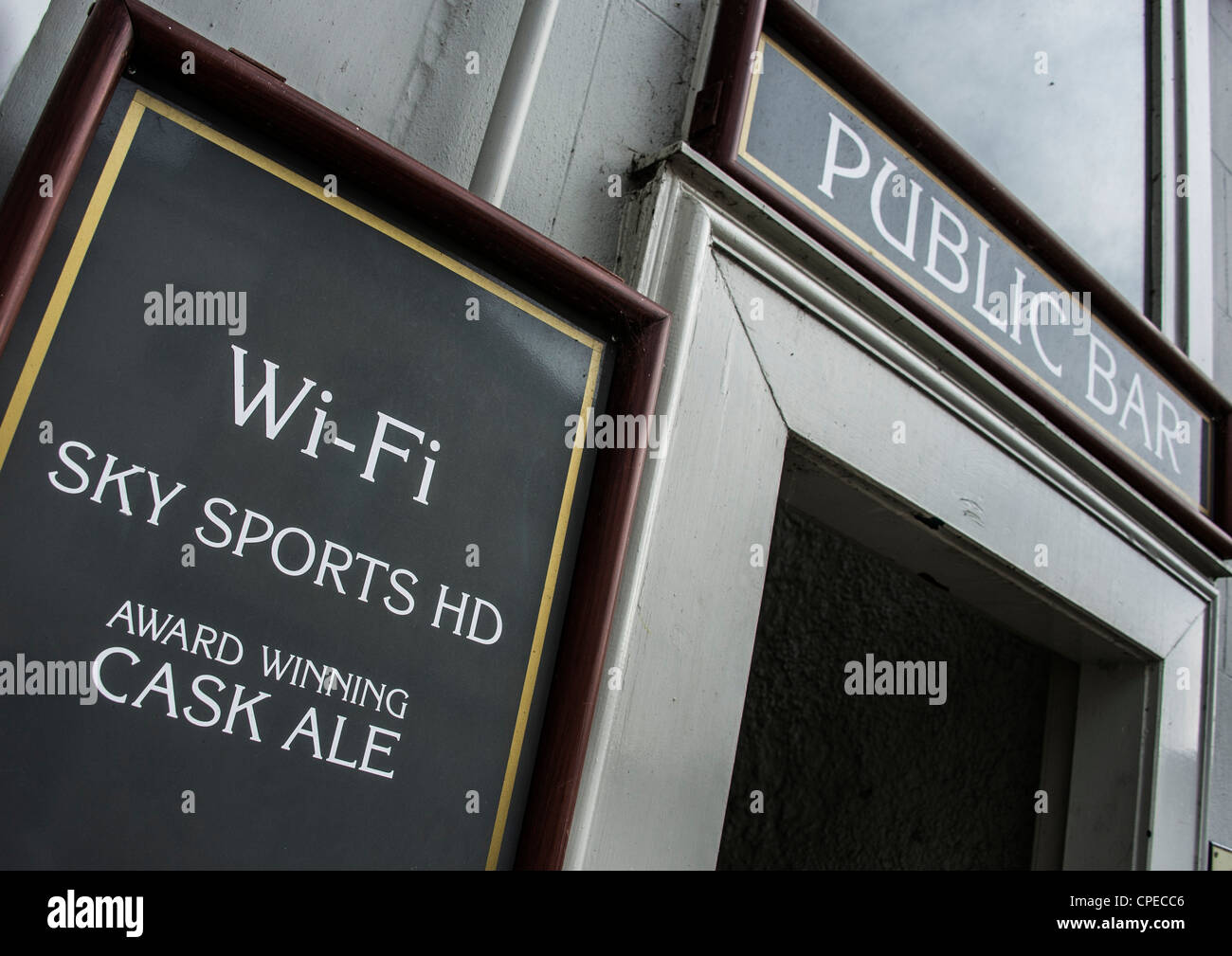 Public bar - pub - in Britain with sign for Wifi internet access and Sky Sports HD television, as well as cask real ales. Stock Photo
