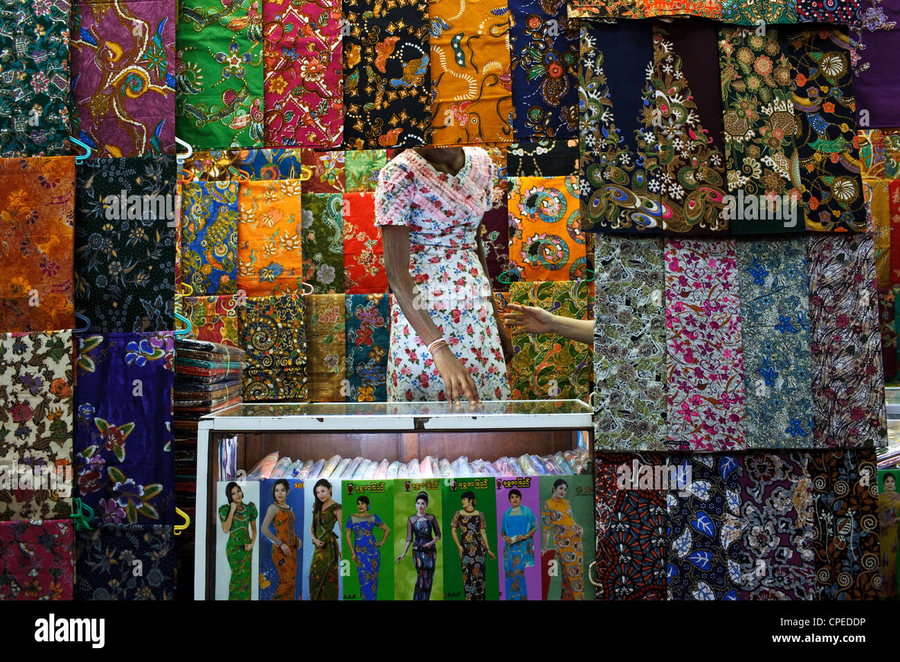 A colorful fabric store at Bogyoke Aung San Market, Yangon (Rangoon), Myanmar (Burma). Stock Photo