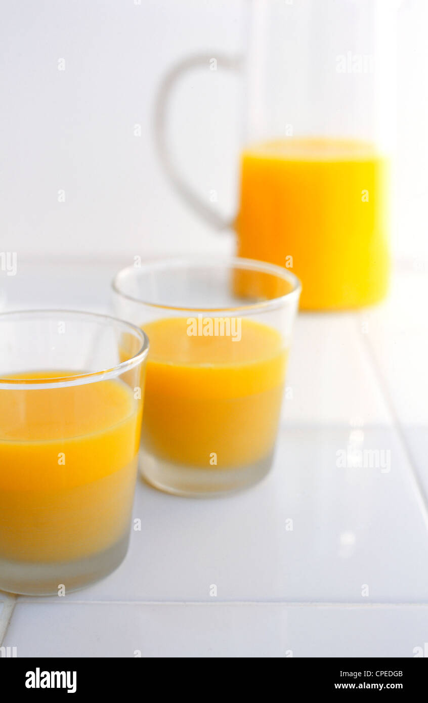 Glass jug with orange juice Stock Photo - Alamy