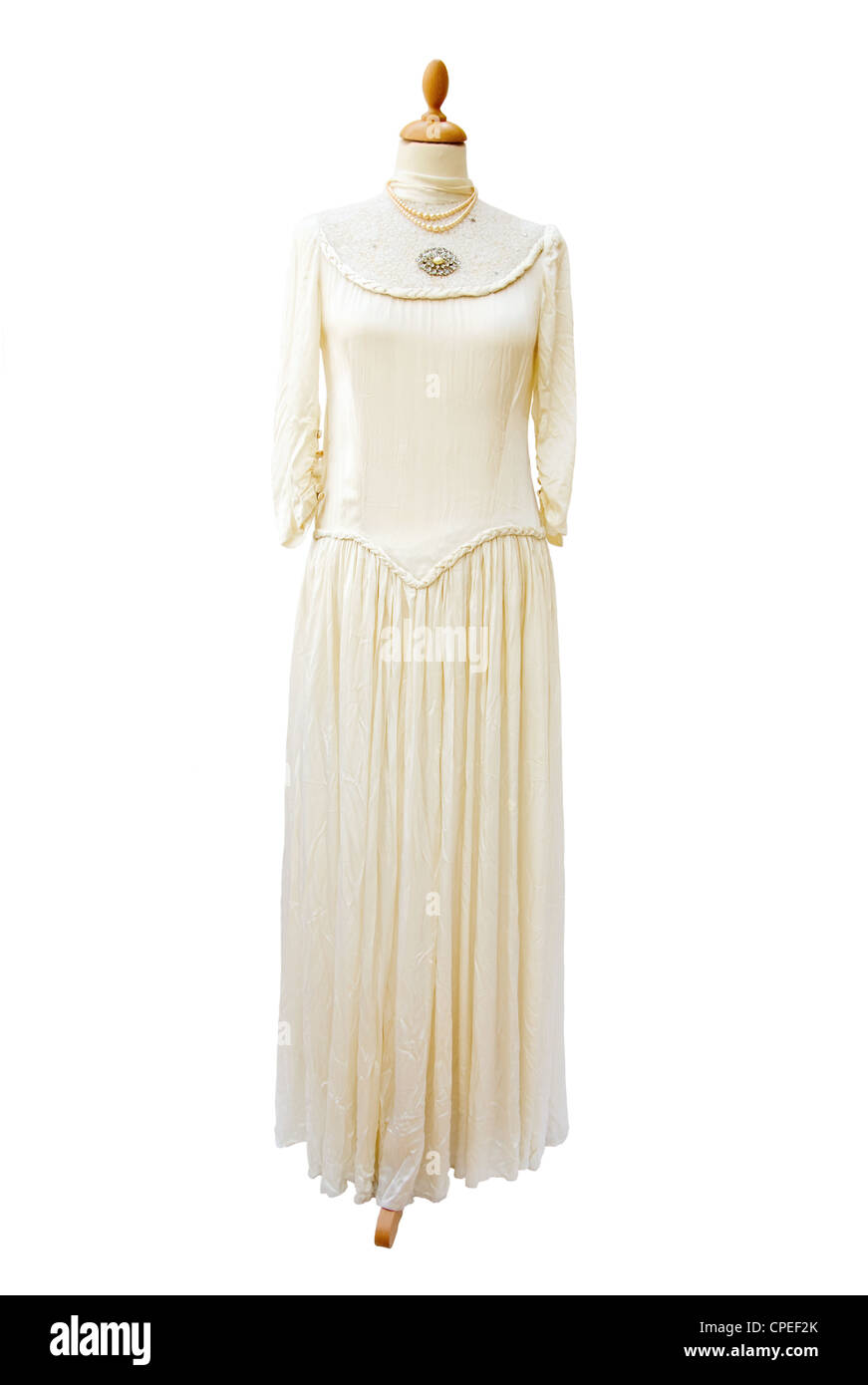 Genuine antique 1930 white satin bride dress. Full length. Isolated over white background. Stock Photo