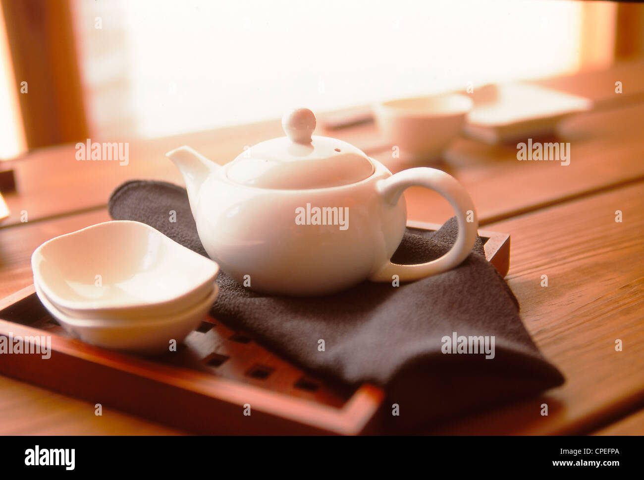 Teapot, Bowl And In Wooden Tray Stock Photo