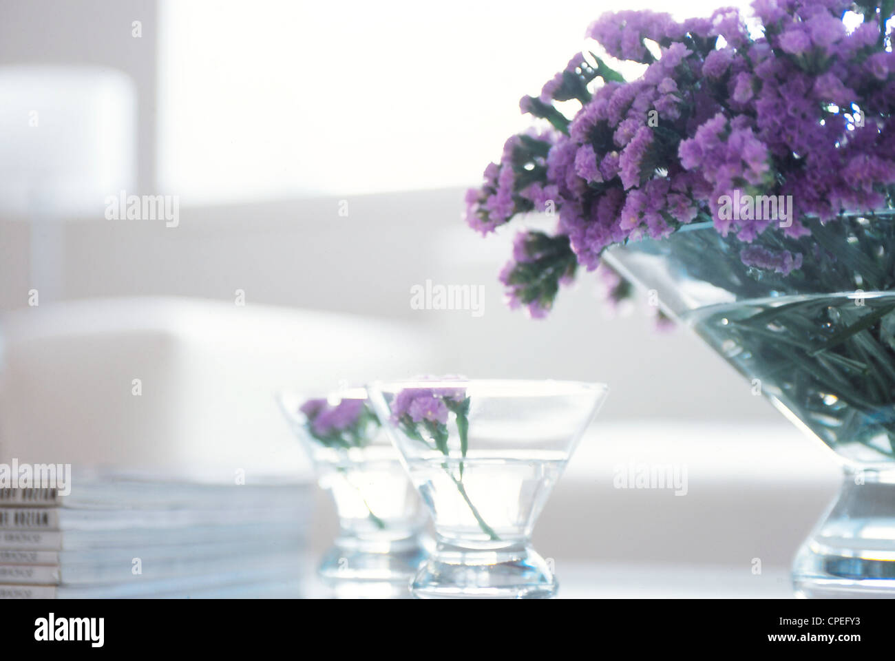 Purple Flowers In Glass Bowls Stock Photo