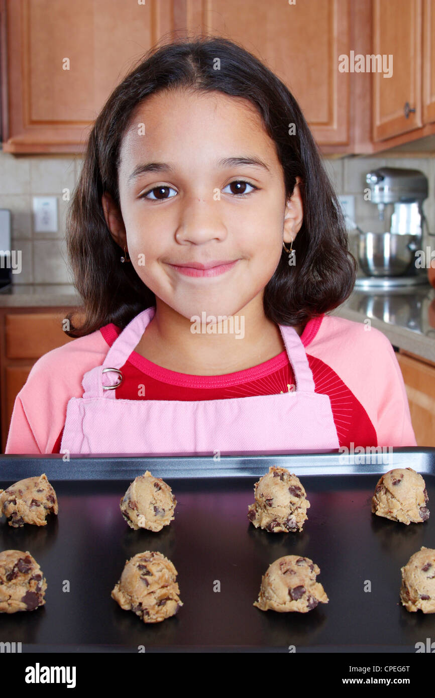 Girl baking chocolate chip cookies in the kitchen Stock Photo Alamy