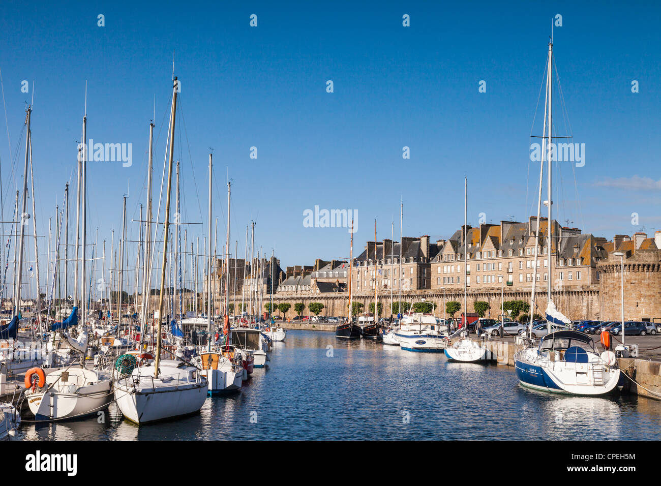 The walled city of Saint-Malo in Brittany, France, across the yacht harbour on a sunny morning. Stock Photo