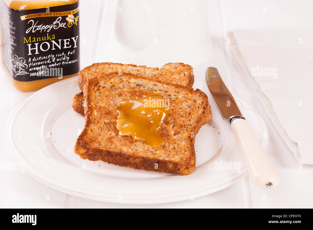 Manuka Honey, a speciality of New Zealand, is known for its anti-bacterial and healing qualities. It is delicious on toast! Stock Photo