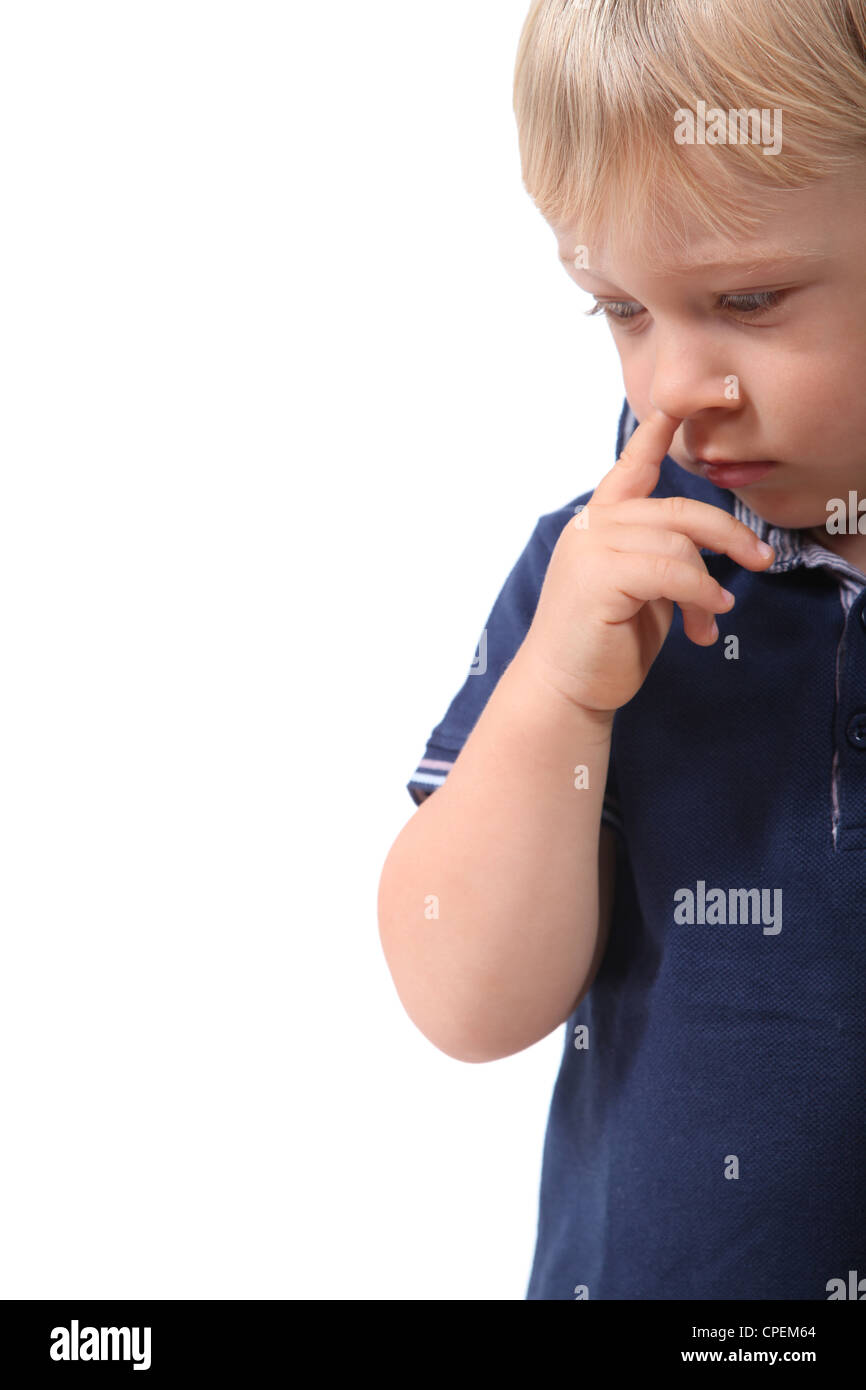 Little boy picking his nose Stock Photo
