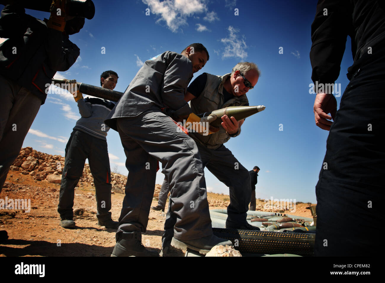 International bomb disposal members and local employees prepare demolition of unexploded ordnance near Sirte, Libya Stock Photo