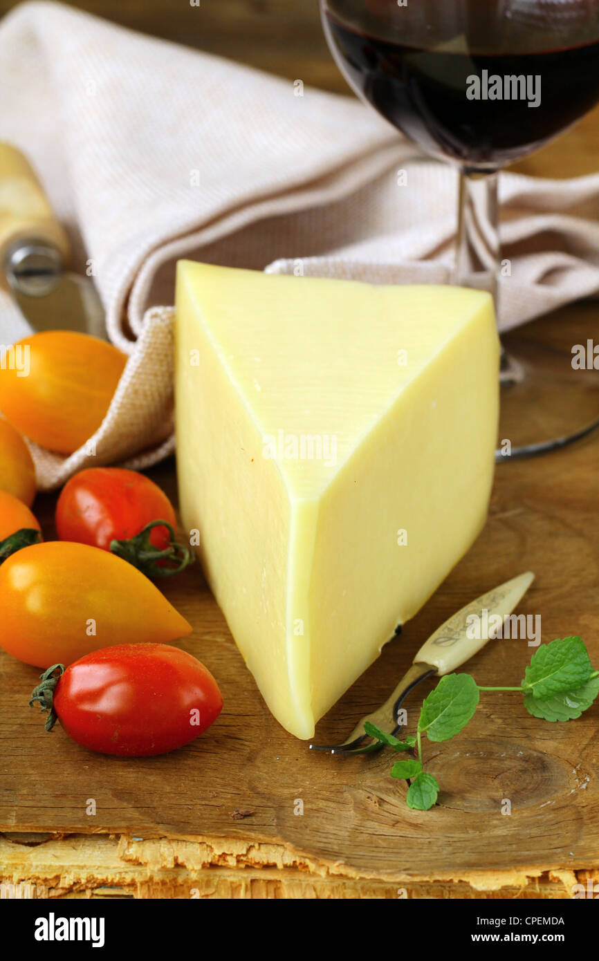 piece of cheese, tomato and cheese knife Stock Photo Alamy