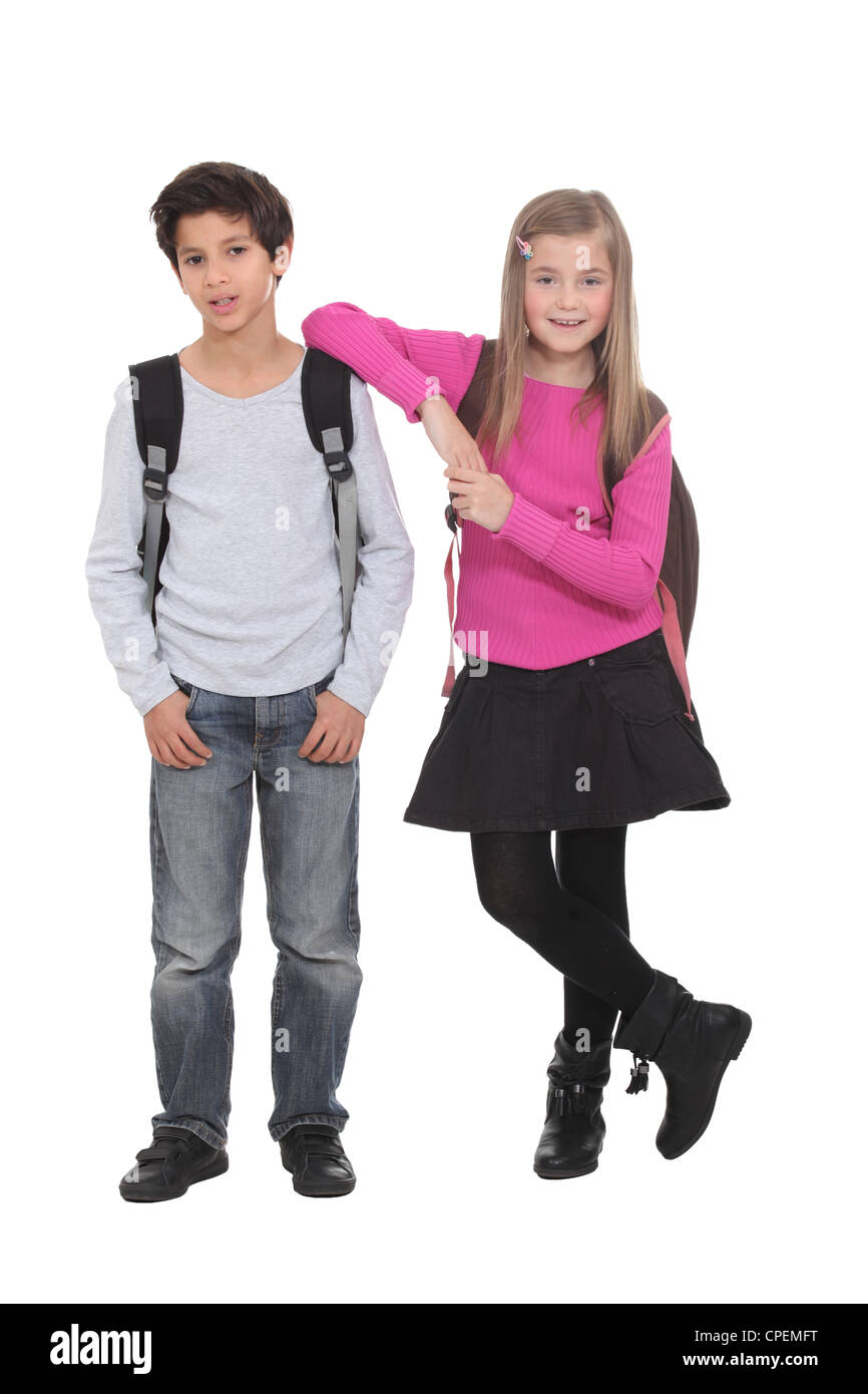 Two school children wearing backpacks Stock Photo Alamy