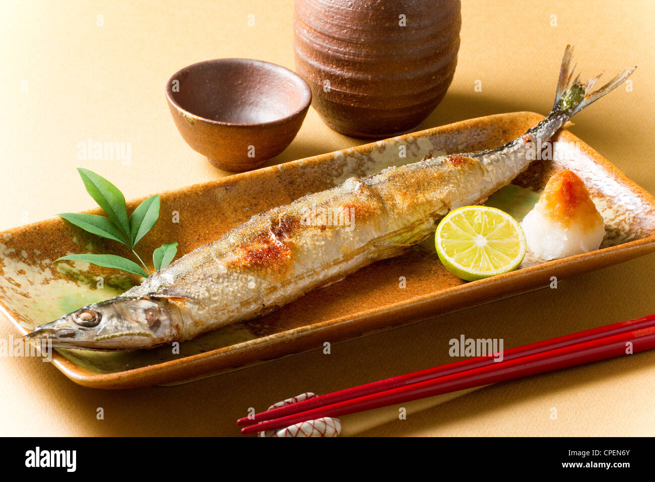 Fish On Tray With Chopstick And Ceramic Pots Stock Photo