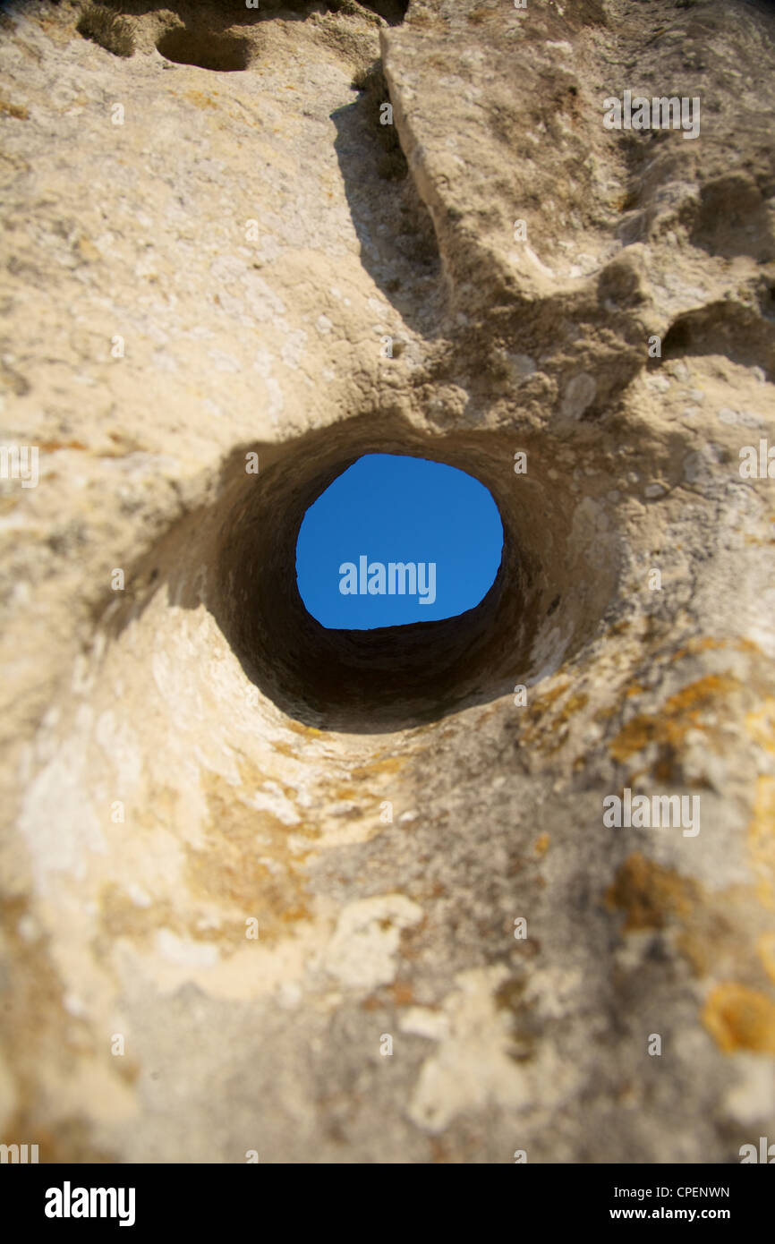 blue sky through a circle hole in stone Stock Photo - Alamy