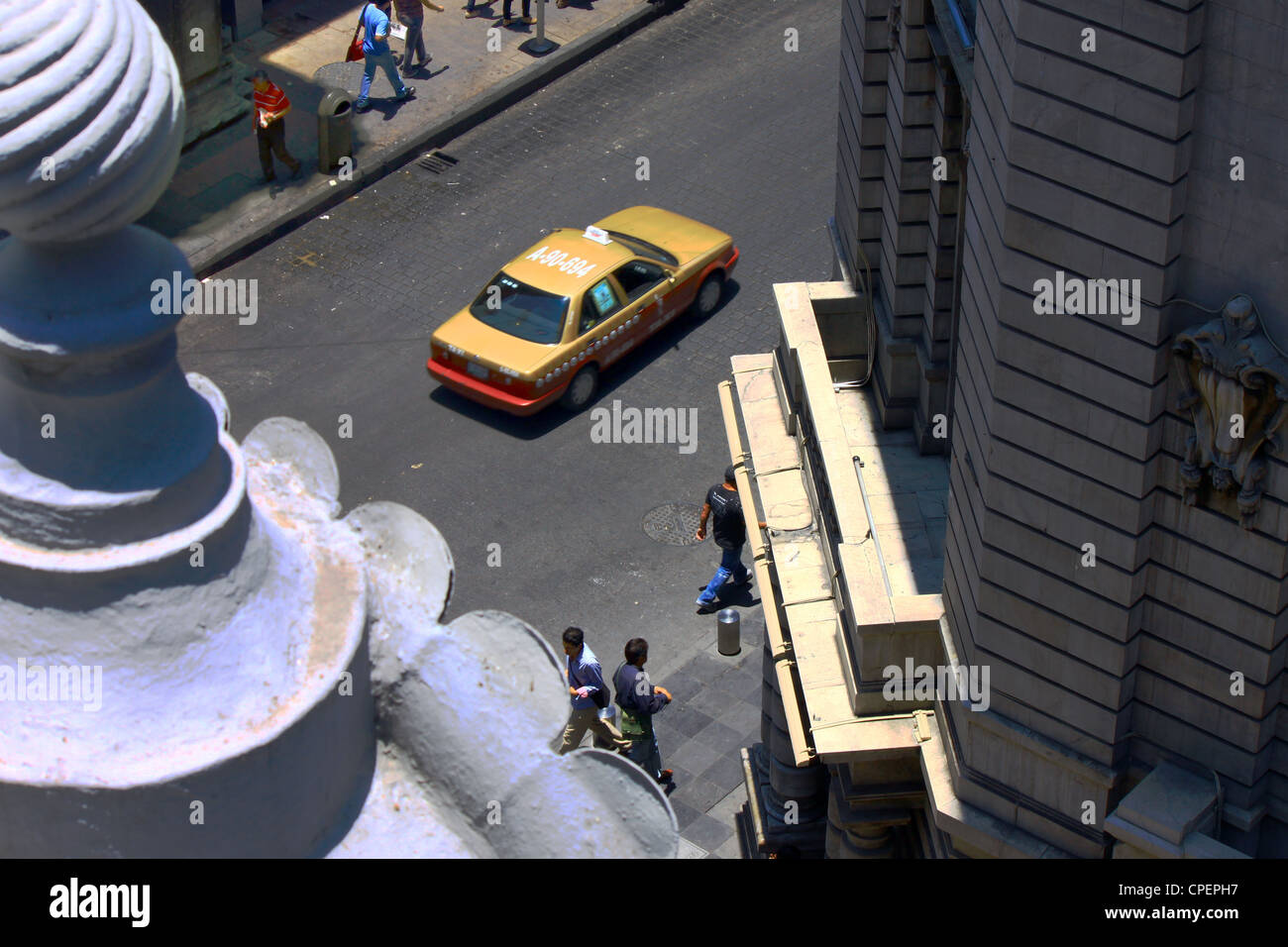 Aerial view of Calle Isabel Catolica. Downtown Mexico City in daylight. Taxi and people passing by. Stock Photo