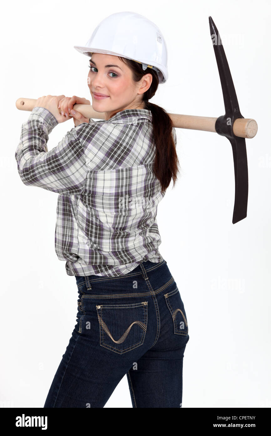 Woman carrying pickaxe Stock Photo Alamy