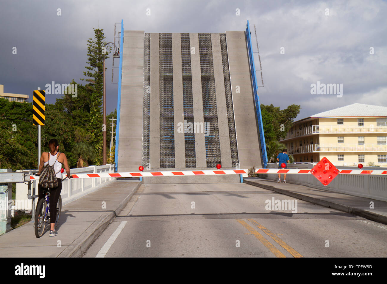 Boca Raton Florida,Palm Beach County,East Camino Real,drawbridge up,over Intracoastal Spanish River water,adult adults woman women female lady,cyclist Stock Photo