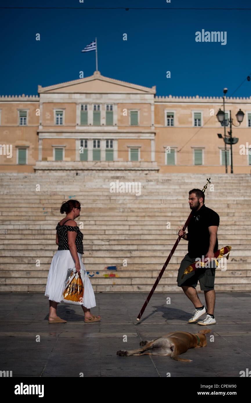 Athenians walking in front of the Greek parliament, Syntagma Sq, Athens, Greece Stock Photo