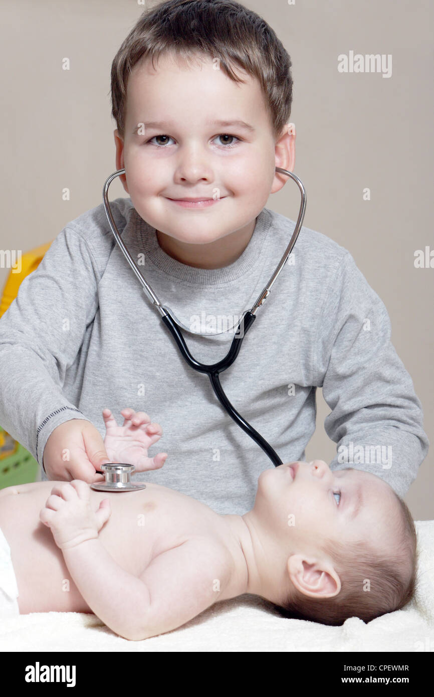 Stethoscope listening to a baby's heartbeat Stock Photo Alamy