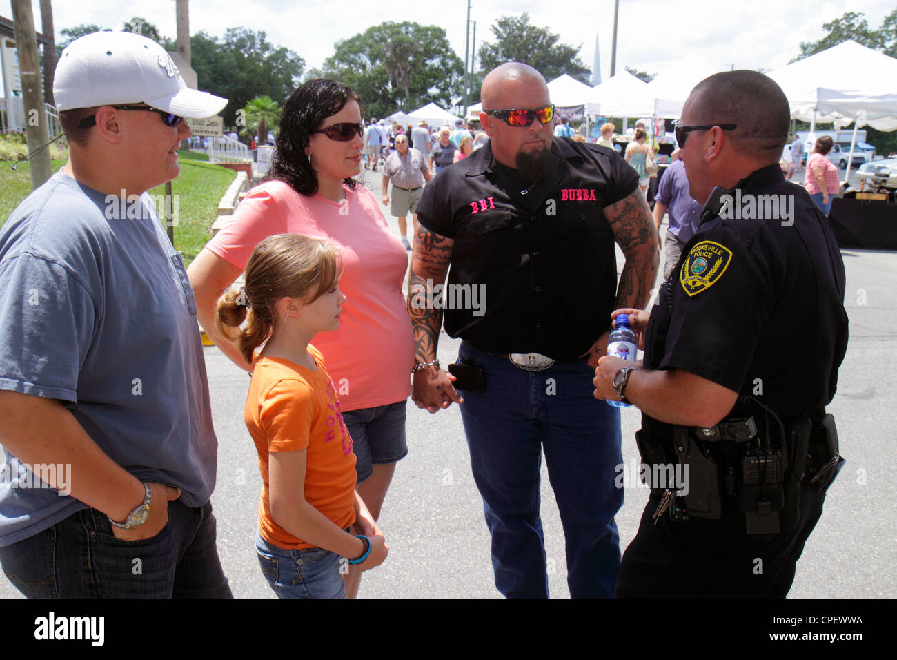 Florida Hernando County,Brooksville,Florida Blueberry Festival,event,Broad Street,police,policeman,man men male adult adults,father dad,parent,parents Stock Photo